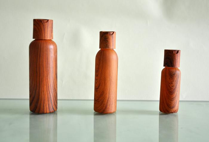CPL Packaging present plastic bottles and caps that look like wood