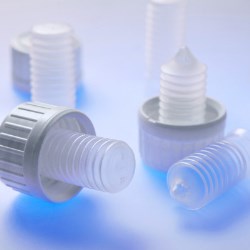 Closures with desiccant and stabilizer