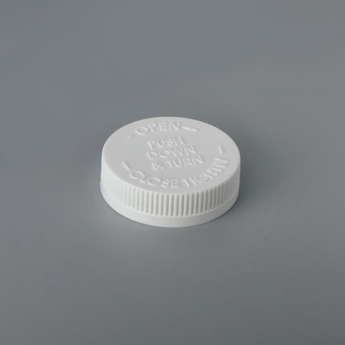 Push Down & Turn Caps (PDT) – Embossed